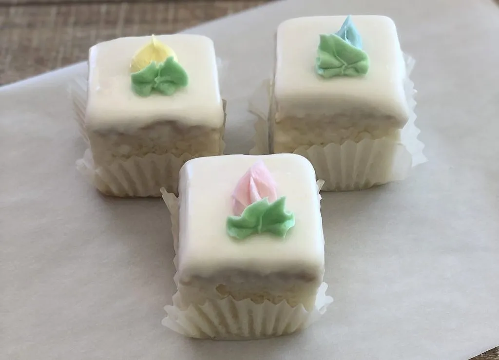 Petit Fours, Bite-size almond cakes in smooth poured icing.