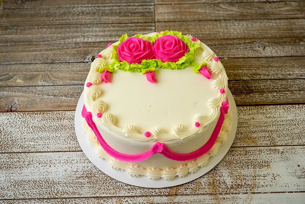 Decorated to Order, Buttercream roses, piped by hand in the shop.
